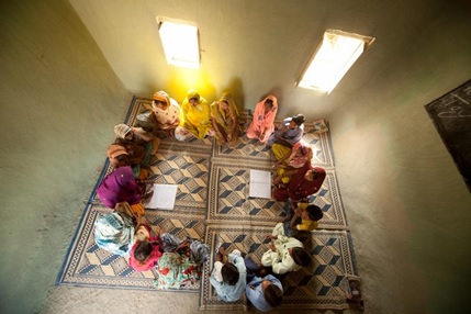 Girls sit in a circle in a classroom in Pakistan. / Save the Children 