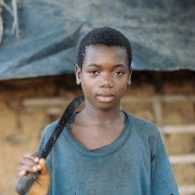 A 13-year-old cocoa worker in West Africa. [From the Robin Romano Archives of the University of Connecticut]/